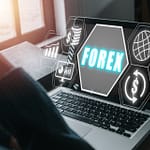 1920 forex trading young man using smartphone and laptop computer with forex icon on vr screen on desk online investment business internet and technology concept